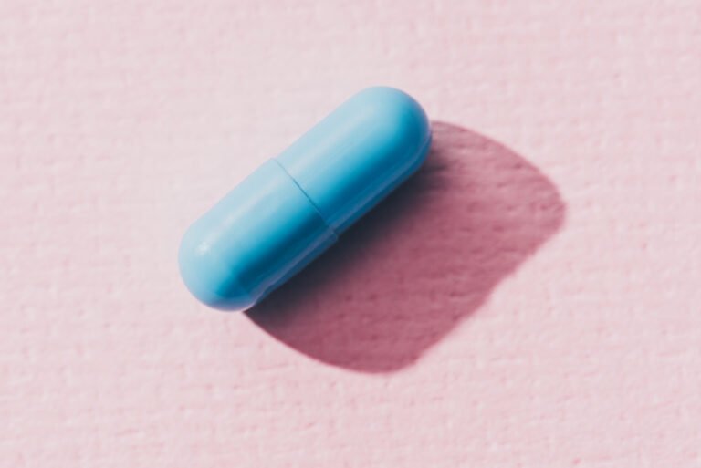 blue medicine on pink surface